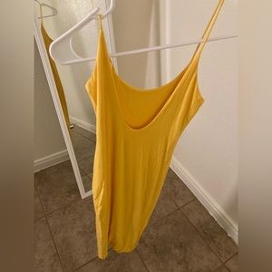 YELLOW DRESS THE STRAP IS RIPPED SO ITS TIED DUE TO TIME TO SOW IT!!